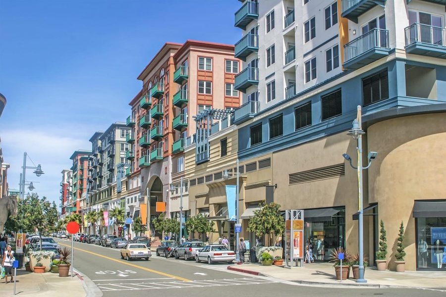 Palm-lined commercial main street with shopfronts on the Peninsula